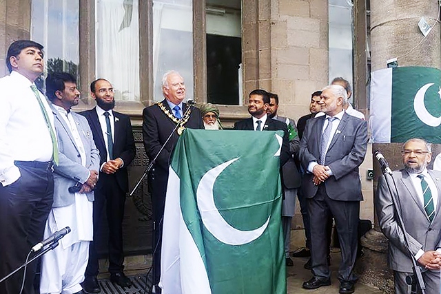 Mayor Ray Dutton addresses the crowd at the Pakistani Flag raising at Rochdale Town Hall