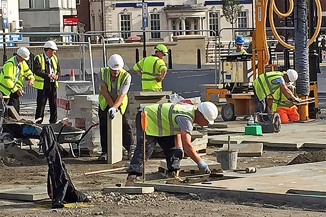 Council staff laying town centre paving