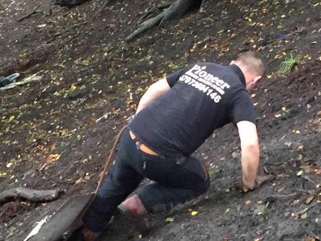 Kurtis Styles dragging the flytipping rubbish from Ashworth Valley