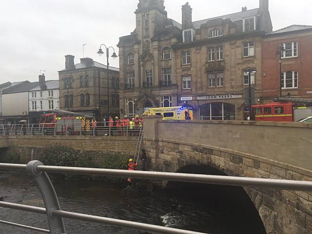 Man in River Roch in Rochdale Town Centre on Saturday morning