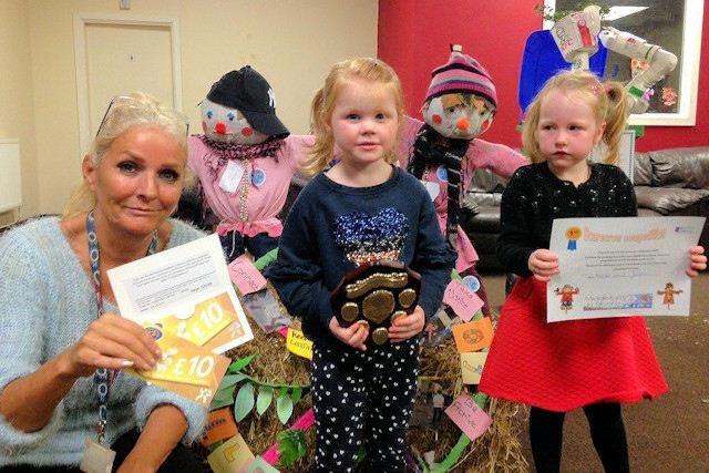 Jill Amos with the Eaton-Dykes family who won first prize