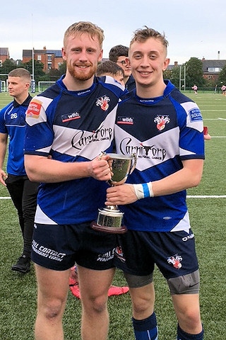 Jordan Cella and Luke Hartley with the trophy