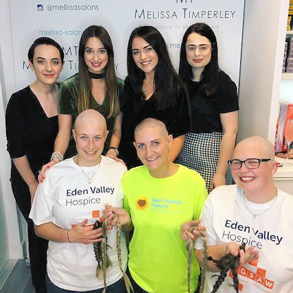 Alice (front left) and Lucy (front right) braved the shave to raise £3,300 for Eden Valley Hospice