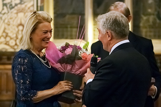 MP Tony Lloyd presents a bouquet of flowers to Lady Cash