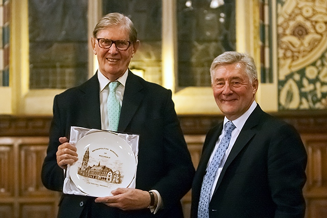 Sir Bill Cash is presented with a commemorative plaque by MP Tony Lloyd