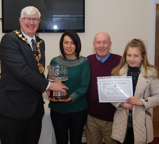 Mayor Ian Duckworth presents ‘The Bill O’ Bows Trophy’ to the Late Rita Jones’ daughter Catherine, Rita’s husband Peter and grand-daughter Keira