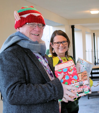 RBH volunteer co-ordinator Brian Lonergan and RBH deputy chief executive Nickie Hallard delivering Christmas shoeboxes