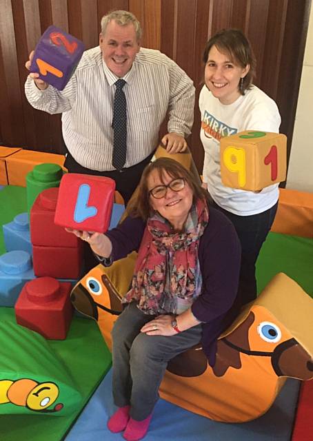 Richard Farnell and Kathleen Nickson try out the new soft play area with Rev Angela Bryan