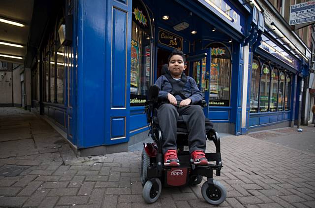 Daniel Tewilde-Hagos enjoying his powered wheelchair