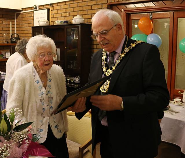 Mayor Ray Dutton presents Gladys Liddell with a special certificate to celebrate her 100th birthday