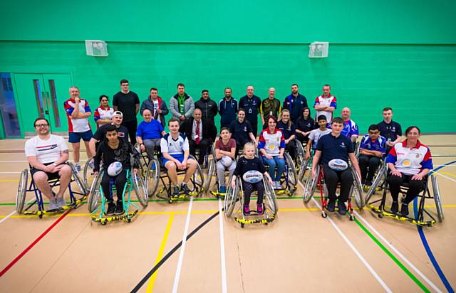 Sajjad Miah with members of the Rochdale Hornet’s Wheelchair Rugby team