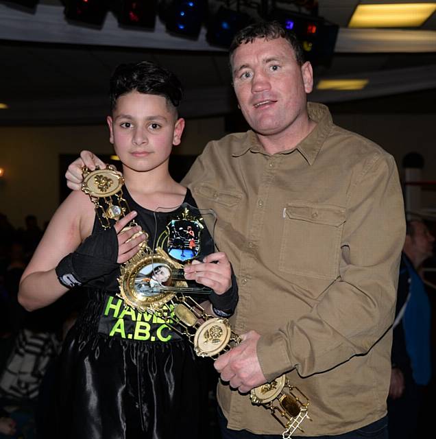 Former British Super Featherweight champ Micheal Gomez presenting trophy to 12 year old Hamer boxer Sarhan Khan