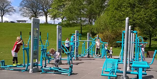 Families enjoying the sun in Springfield Park