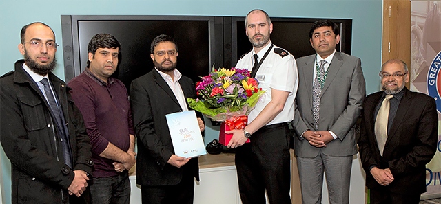 Superintendent John Ruffle was presented with a floral bouquet by members of the Pakistani and Kashmiri Community Association