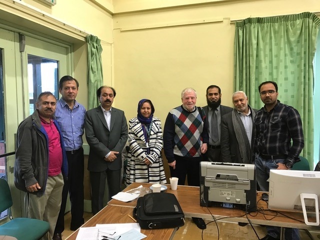 Consulate of Pakistan staff with local community members delivering services at Deeplish Community Centre