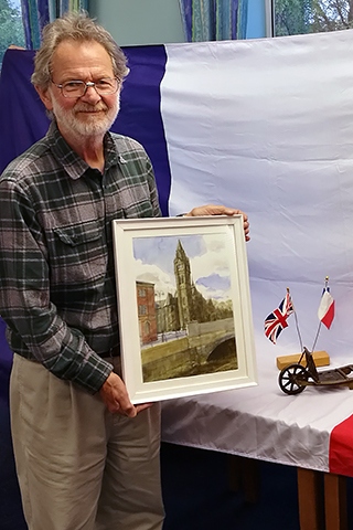 Tony Smart with his painting featuring the new bridge over the River Roch in the town centre