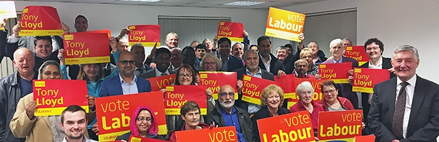 Tony Lloyd at the new Labour campaign offices with party members.