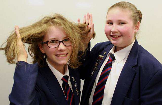 Jasmine Clayton and best friend Katie Heath examine her new short hair cut