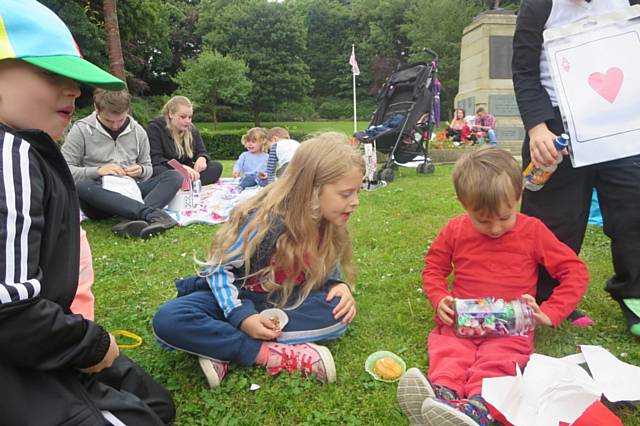 Present: Children enjoy their cakes and wins from the ‘surprise jar’ stall