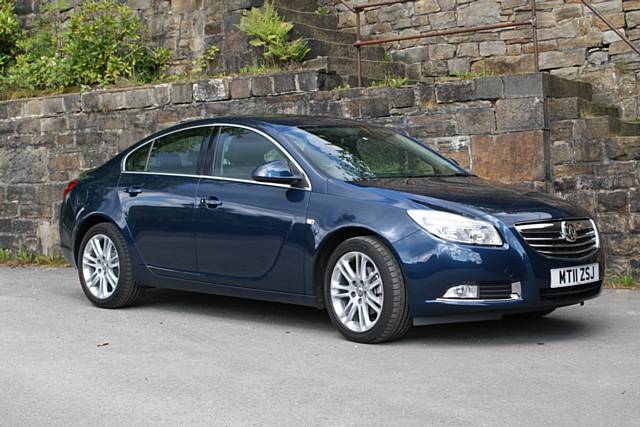 Blue saloon four door Vauxhall Insignia reg no MT11 ZSJ stolen from the Rochdale Fire Museum yard 