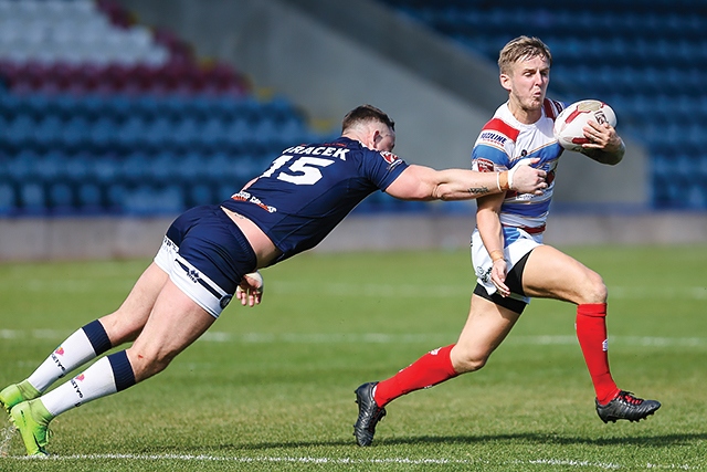 Rochdale Hornets v Swinton Lions<br />Swinton's Andy Bracek attempts to tackle Danny Yates