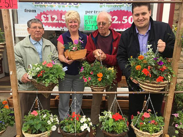 Clifford Barron, Shirley Wilkinsin, Neil Chadwick and Councillor John Blundell with some of of the hanging baskets soon to brighten up Firgrove