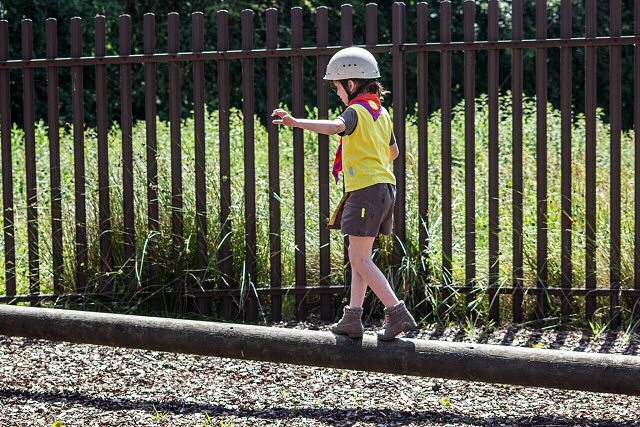 Phoebe Drennan, balances on a Low Ropes element