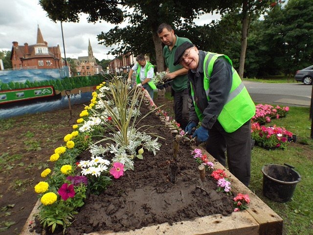 Billy Sheerin and Paul Ellison plant up the floral barge in Castleton