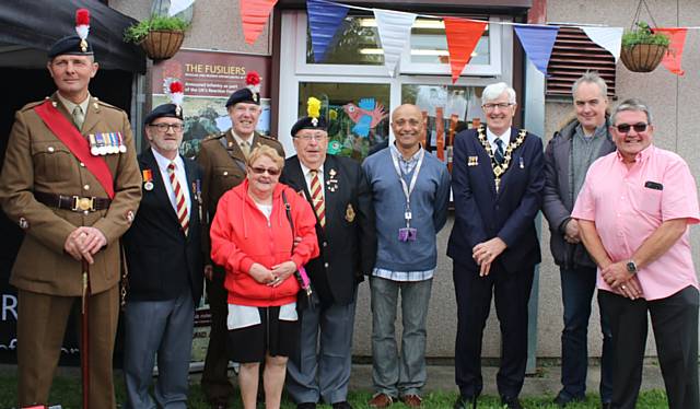 Colonel Glover (third left), Mayor Ian Duckworth (third right) and RBH Chief Executive Gareth Swarbrick (second right) with residents