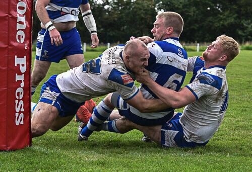 Callum  Marriott and Luke Fowden combine to stop a Siddal attack