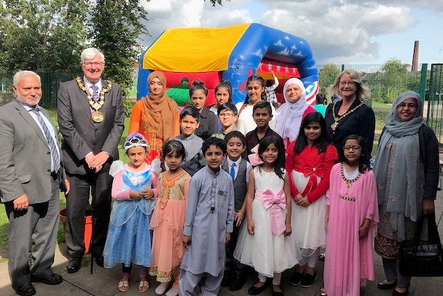 Mayor Ian Duckworth and Mayoress Christine Duckworth with councillors, children and volunteers at Deeplish play scheme