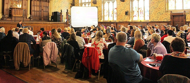 Gail Hopper speaks to a packed town hall 