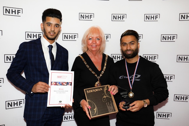 Lixon Chaudhury (right) has been crowned one of the UK's best barbers. Pictured here with his model and NHF President, Agnes Leonard