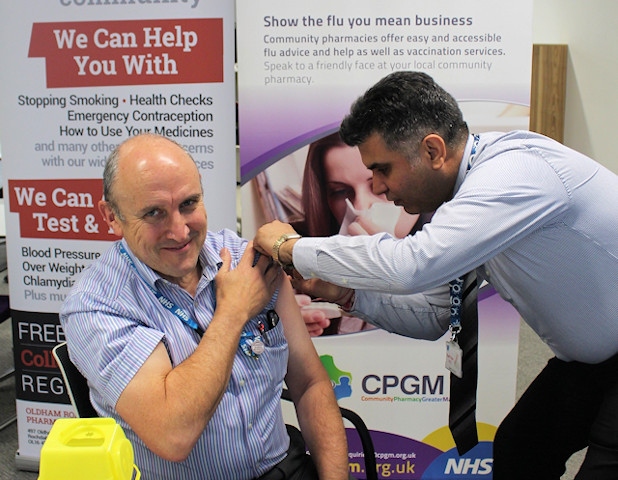 Dr Chris Duffy, Chairman of NHS Heywood, Middleton and Rochdale Clinical Commissioning Group, has his flu jab (2018)