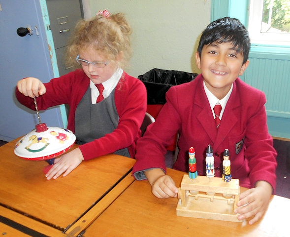 Years 1 & 2 playing with some real Victorian toys 