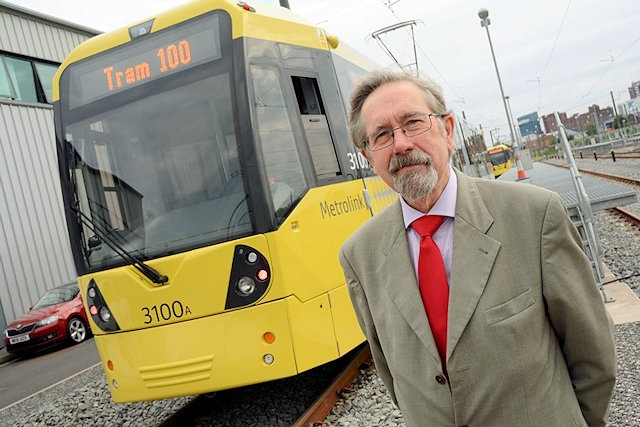 TfGMC Chair Councillor Andrew Fender with the 100th tram