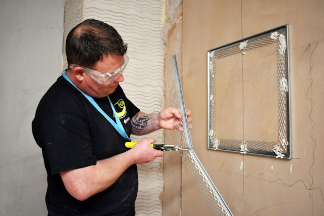 Stuart Smith learning plastering techniques at Hopwood Hall College