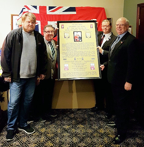 Memorial plaque about Fusilier Lee Rigby presented to Gavin Vitler, the founder of Rigby's Guardians Bike Club, by Councillor Ray Dutton, and the Heywood Veteran’s Association with Councillor Peter Rush