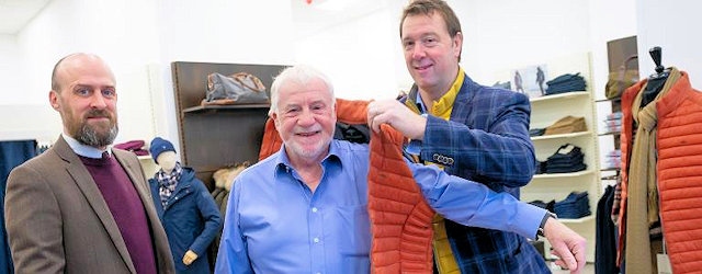 Councillor Allen Brett trying on jumper in the new Buckleys menswear shop