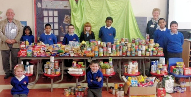 Belfield School pupils with Iain Wight and Margaret Ogden of Rochdale Foodbank