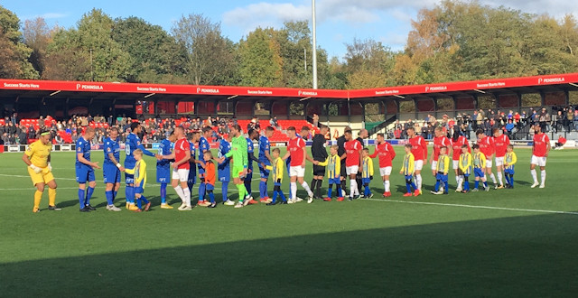 Escorting Salford City onto the pitch