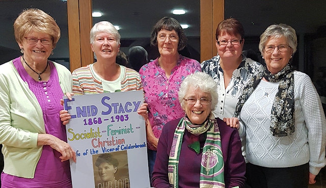 Rae Street (seated) with members of St Andrew's Mothers Union and their Enid Stacy banner. Left to right back: Pam Paterson, Jo Hill, Janice Halstead, Rev Rachel Battershell, Edna Burrow

