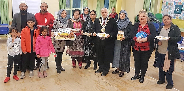 Mayor Mohammed Zaman (centre) with participants at the food festival