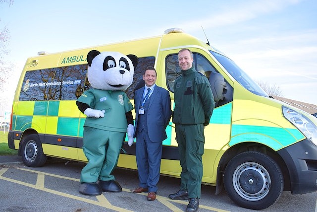 North West Ambulance Charity Development Manager, Vincent Sherard-Bornshin (centre), with mascot Pandamedic (left) and David McNally, Community Engagement and Resuscitation Manager at North West Ambulance Service (right)