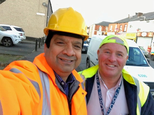 Councillor Faisal Rana, Spotland & Falinge Ward with the local street cleaning team
