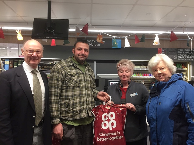 Paul Ellison with Councillor Jim Gartside (left) and his wife, Jane (far right), and Co-op store manager, Sharon Leighton