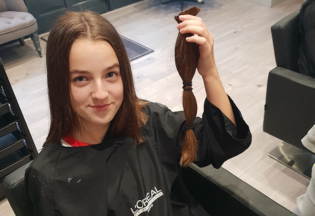 Olivia Bell donated 14 inches of her long hair to charity, raising £270 in the process