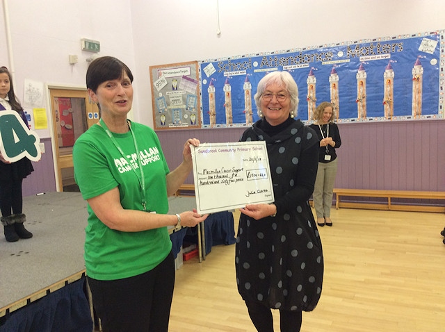 A representative from Macmillan was presented with the cheque