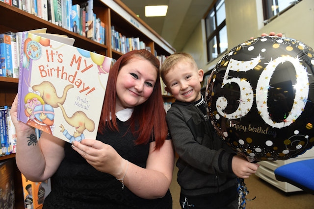 Senior Librarian and Information Assistant Hannah Clarke joins 5 year old Riley Kay at the Alkrington Library 50th Anniversay event