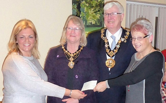 The Friends of Hopwood Park are presented with a cheque by the Mayor and Mayoress 